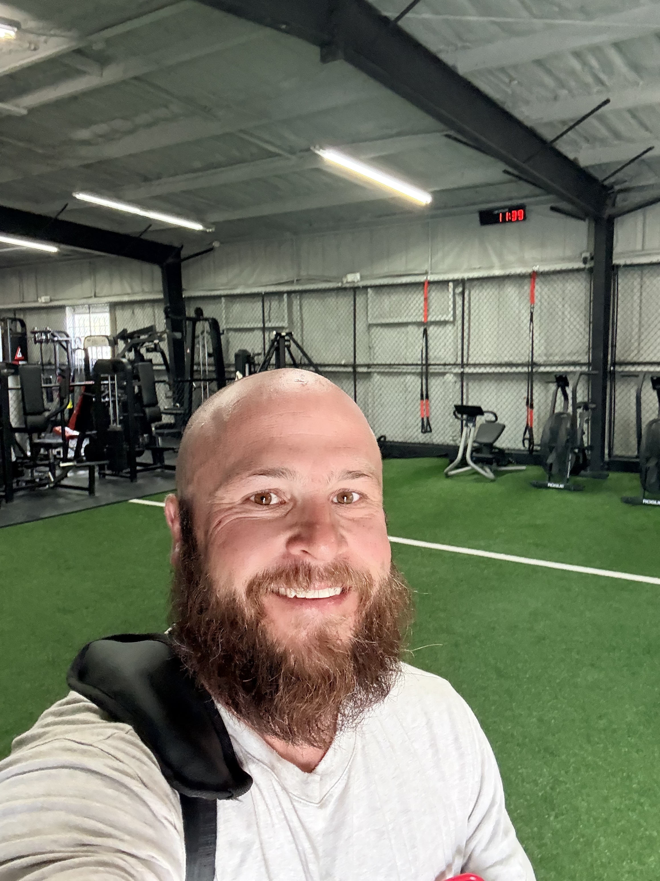 Mike posing in a gym selfie